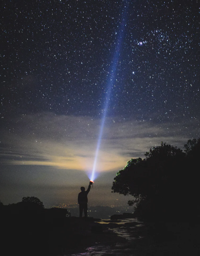 a person lighting up the sky